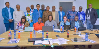 Mamadou Alpha Diallo (back row, 5th from left) joins ELAW Attorneys Érick Kassongo (back left) and Jennifer Castello (front row, 2nd from right) and colleagues at CODED.