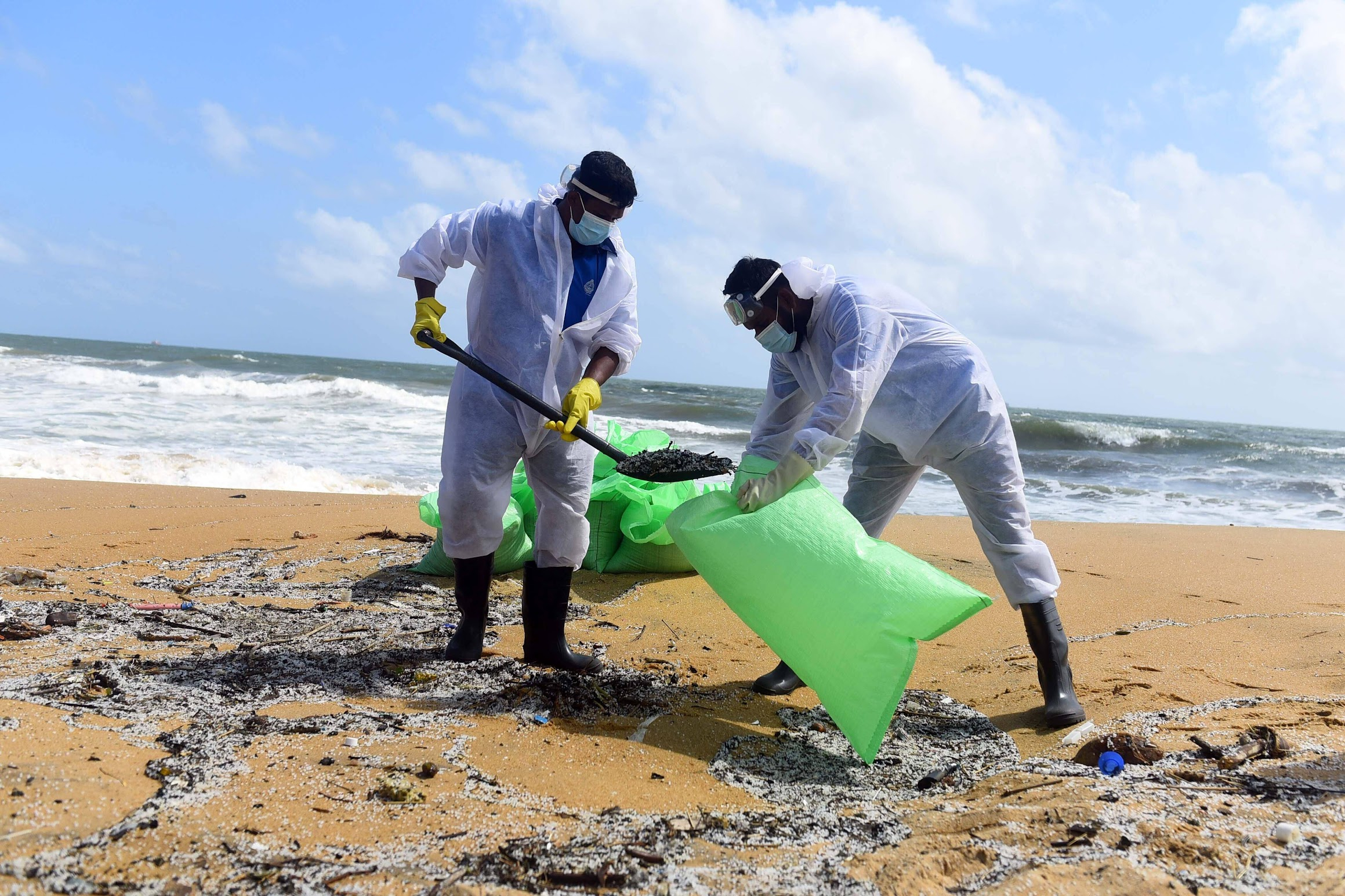 Naval personnel remove debris from the X-Press Pearl cargo ship at Negombo Beach, Sri Lanka. PHOTO: Imago/Alamy